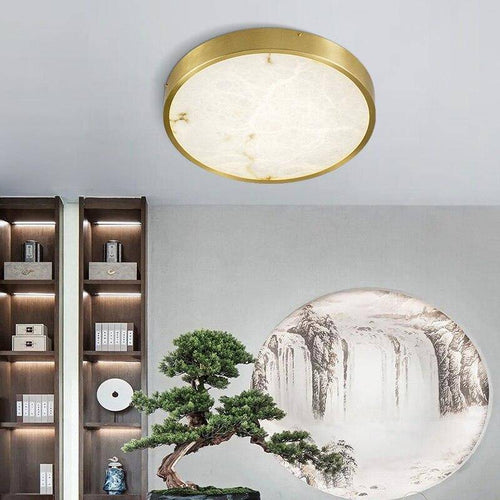 Lámpara de techo design LED redonda de mármol con bordes dorados