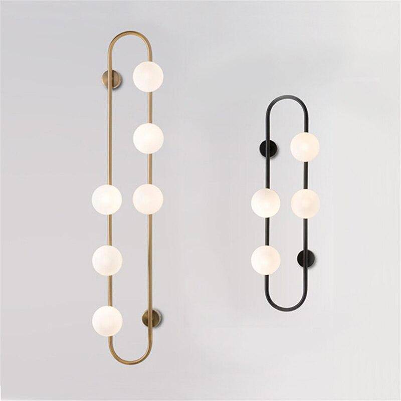 Lámpara de pared design LED con anillo metálico y bola de cristal