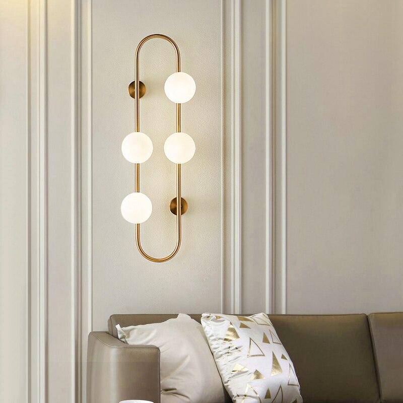 Lámpara de pared design LED con anillo metálico y bola de cristal