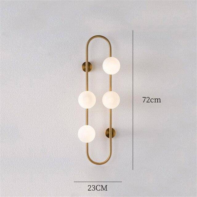 Lámpara de pared design LED con anillo metálico y bola de cristal