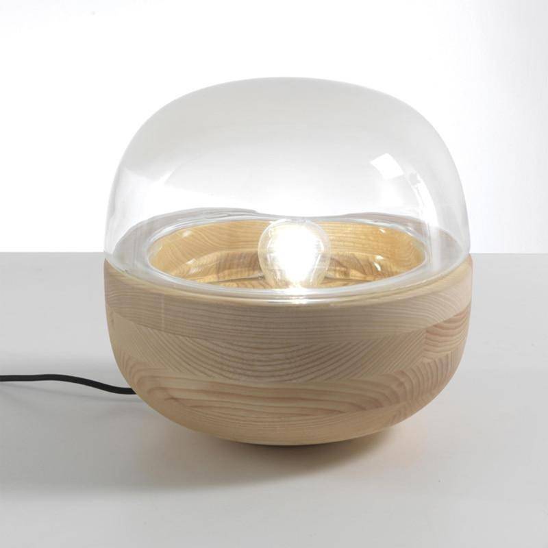 Moderna lámpara de mesa LED con base de madera y base de cristal redondeada