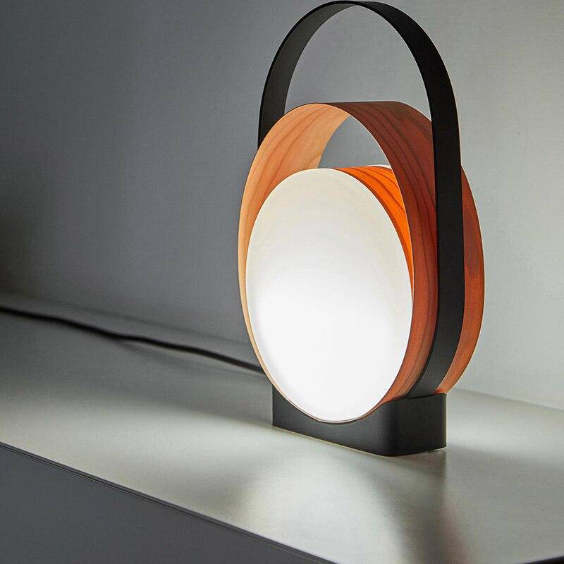 LED design table lamp with metal rings and light disc