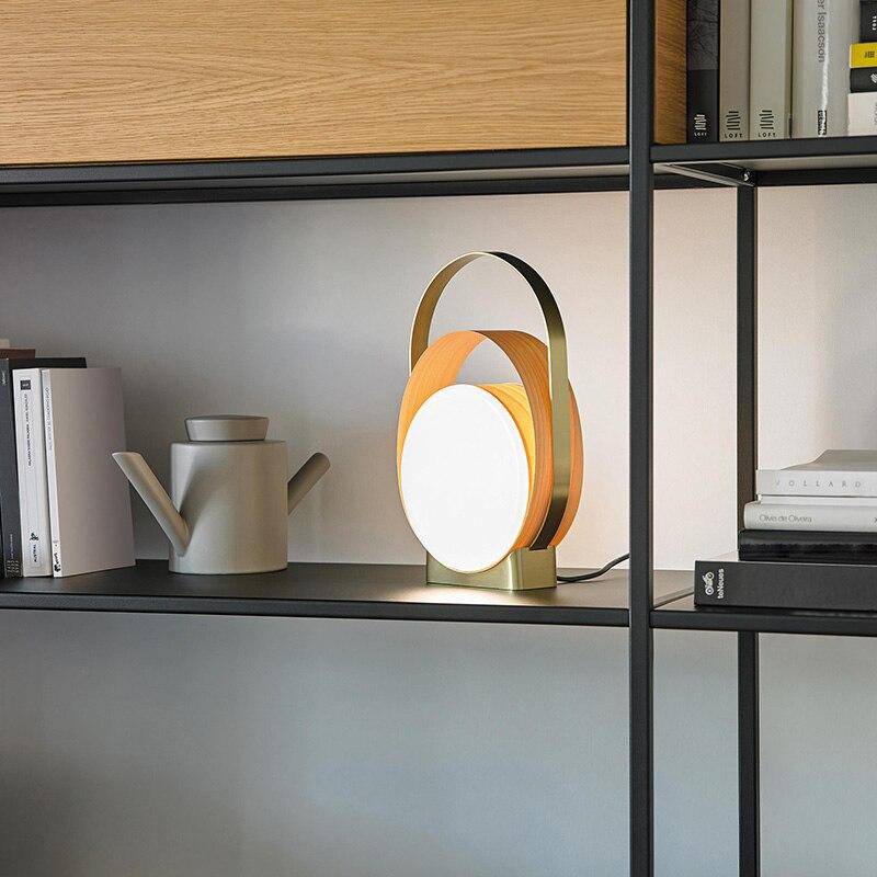 LED design table lamp with metal rings and light disc