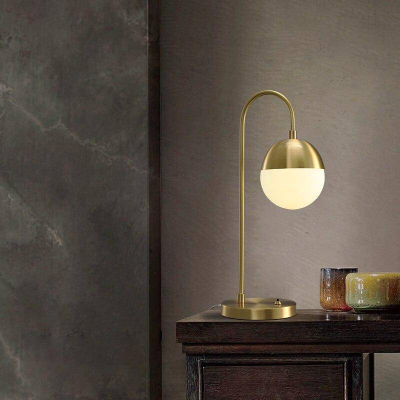 LED design table lamp with gold arm and glass ball Soft