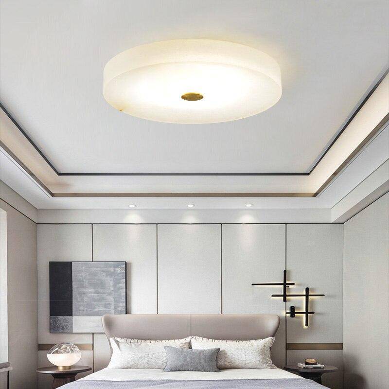 Plafonnier design LED marbre arrondi avec disque doré Villa