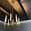 Lustre design LED avec tiges dorées et verre style Hotel