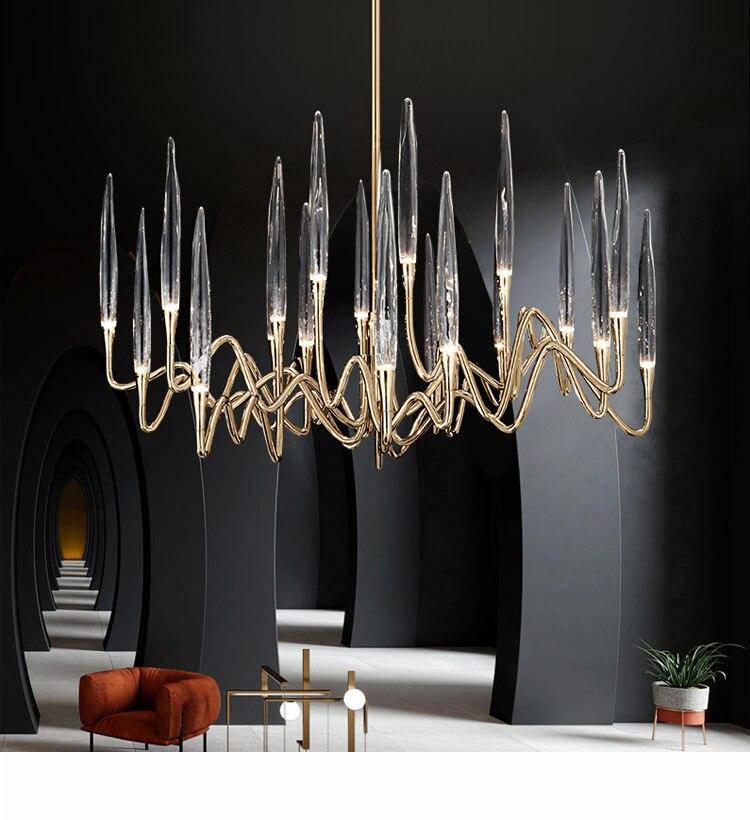 Araña design LED con varillas doradas y cristal de estilo hotelero
