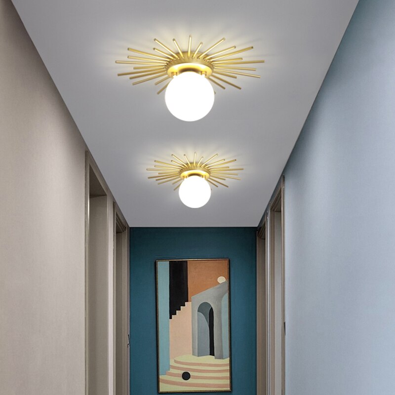 Modern LED ceiling light with metallic sun and Sana globe