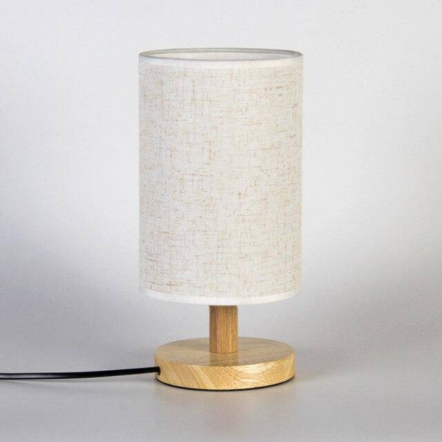 Bedside lamp with lampshade in cylindrical fabric