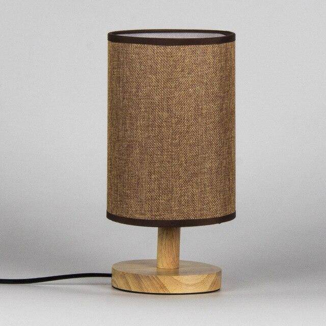 Bedside lamp with lampshade in cylindrical fabric