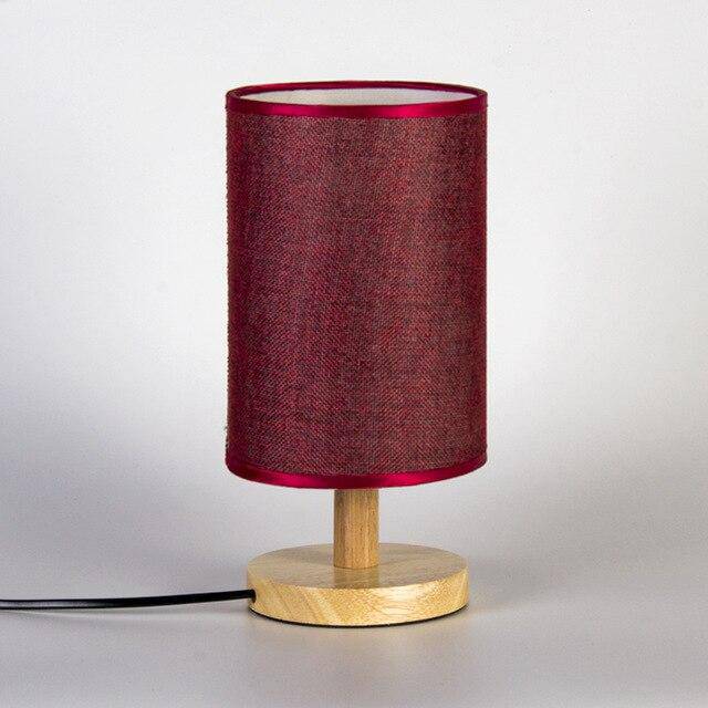 Bedside lamp with lampshade in cylindrical fabric