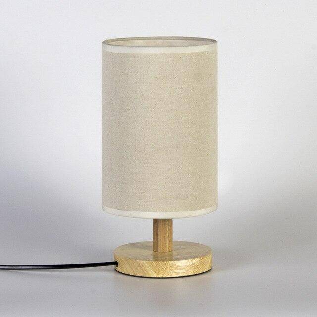 Bedside lamp with lampshade in cylindrical fabric