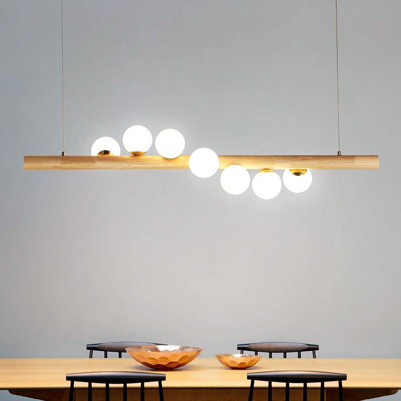 Wooden LED chandelier with several spheres in Scandinavian style