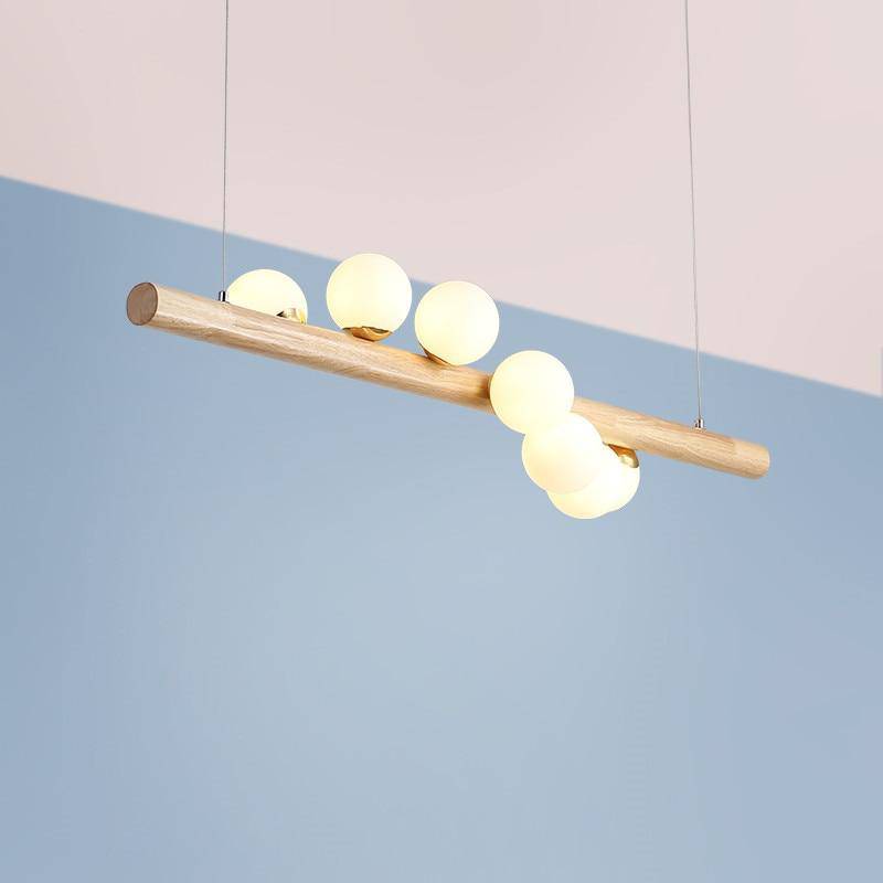 Wooden LED chandelier with several spheres in Scandinavian style