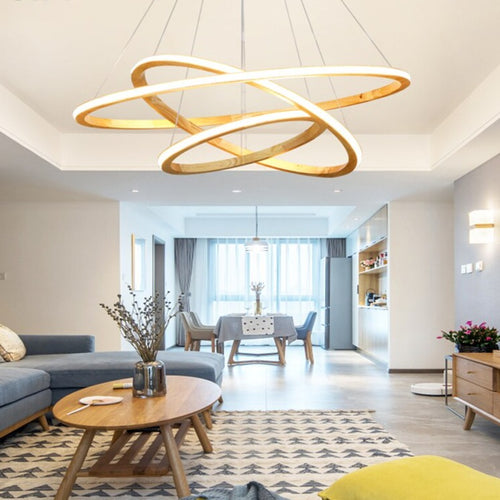 Modern LED chandelier with illuminated wooden ring Ibarne