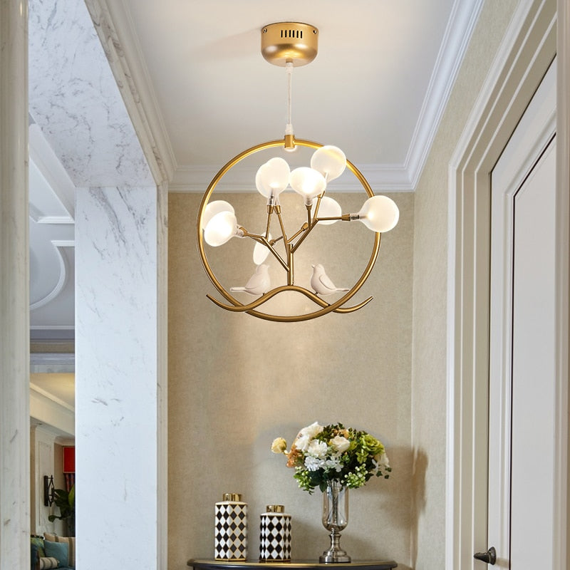 Modern chandelier with tree and birds in Rhym ring