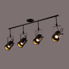 Lustre rétro à LED en métal noir avec plusieurs spots cylindres Loft
