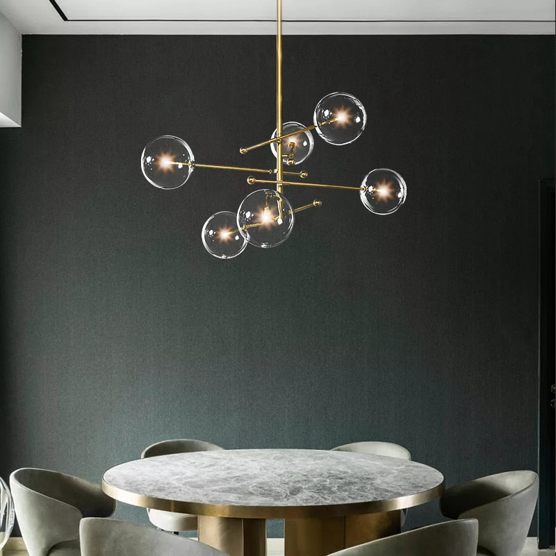 LED design chandelier with gold metal base and Zuri glass globes