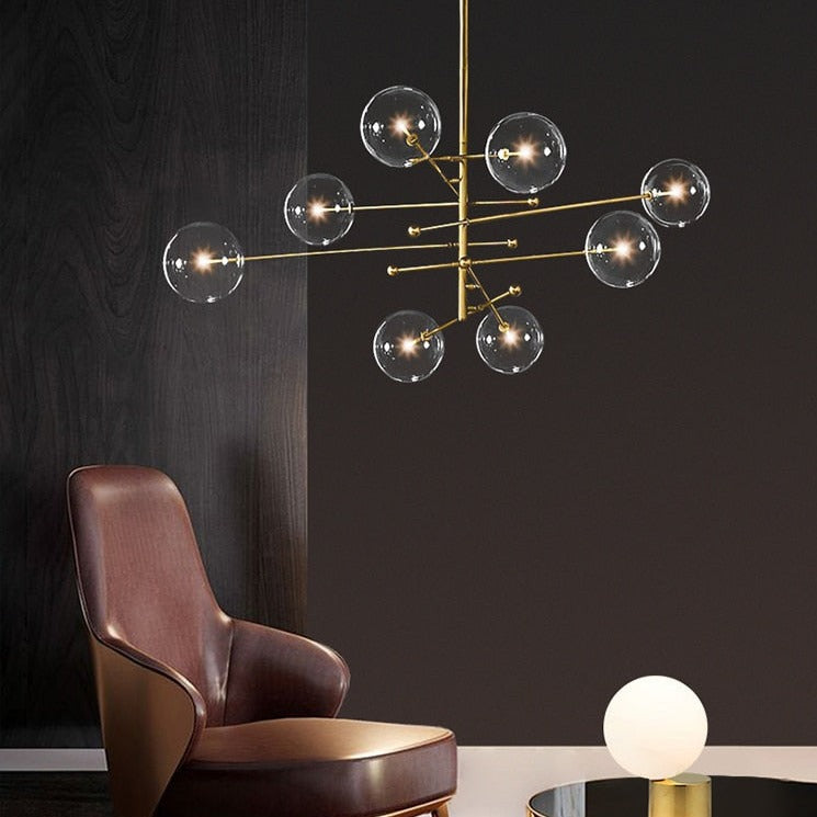 LED design chandelier with gold metal base and Zuri glass globes