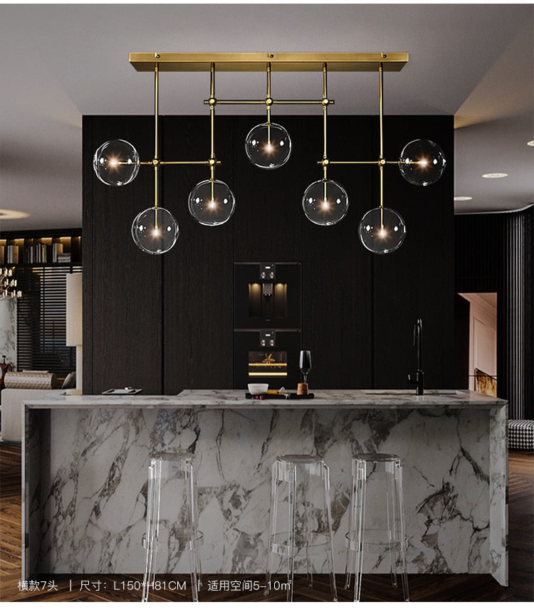 LED design chandelier with gold metal base and Zuri glass globes