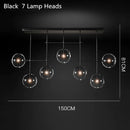 Lustre design LED base en métal doré et globes en verre Zuri