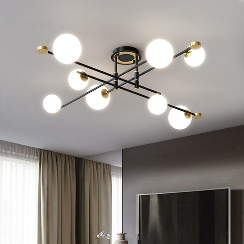 Modern LED chandelier with black cross arms and gold details Poline