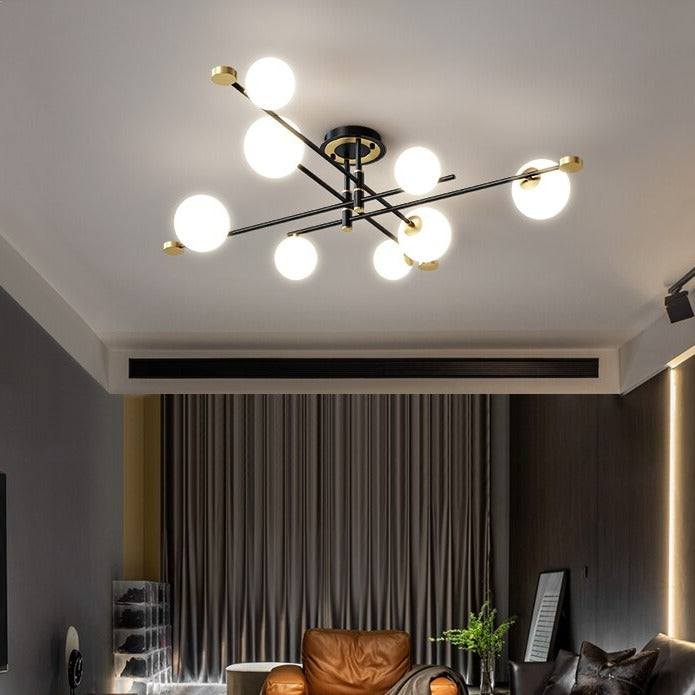 Modern LED chandelier with black cross arms and gold details Poline