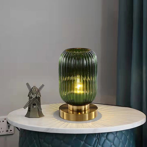 Lampe à poser cylindrique en verre coloré et base dorée Quinn