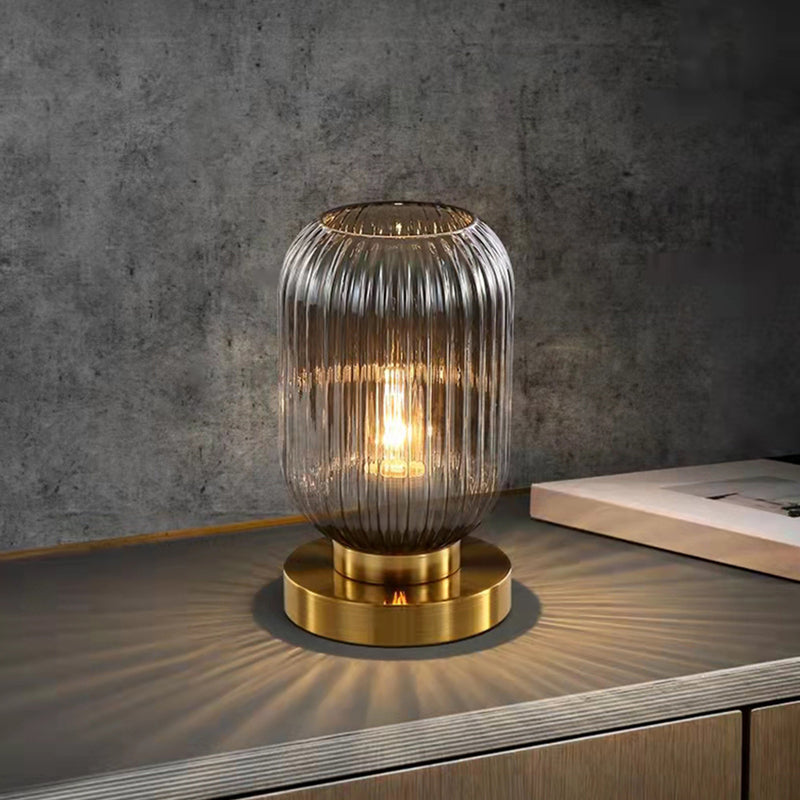 Cylindrical table lamp in coloured glass and gold base Quinn