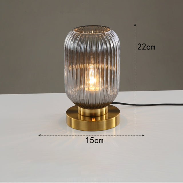 Cylindrical table lamp in coloured glass and gold base Quinn