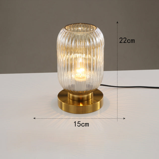 Cylindrical table lamp in coloured glass and gold base Quinn