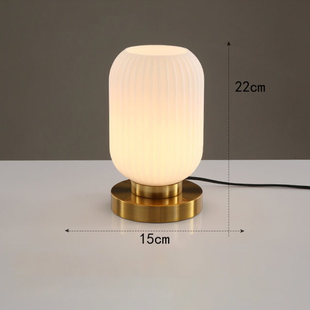 Cylindrical table lamp in coloured glass and gold base Quinn