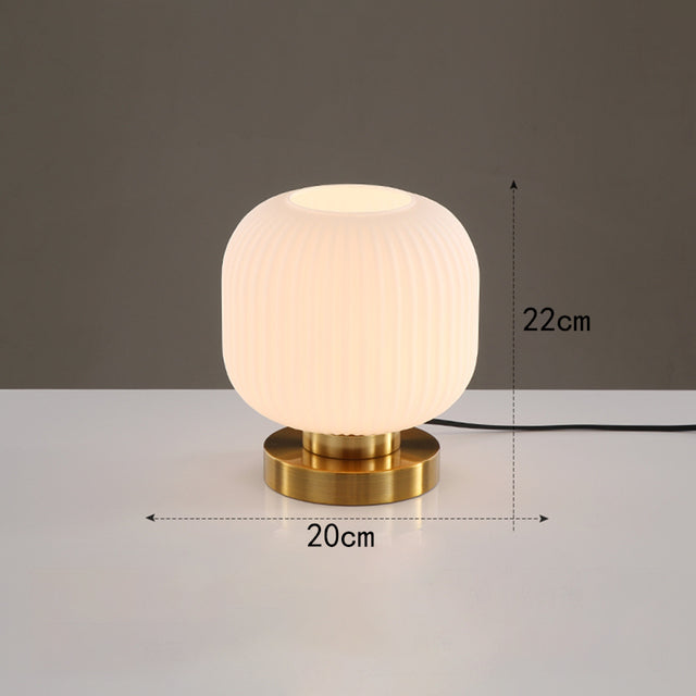 Cylindrical table lamp in coloured glass and gold base Quinn