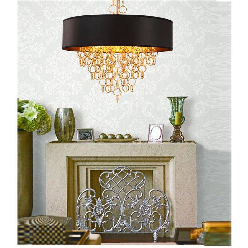 Modern chandelier with lampshade round black and gold details