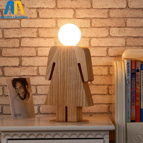 Wooden bedside lamp in the shape of a girl logo
