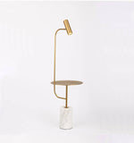 Lampadaire design doré avec table et base en marbre Phube