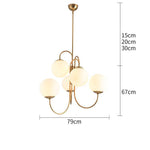 Lustre design avec branches dorées et boule de verre
