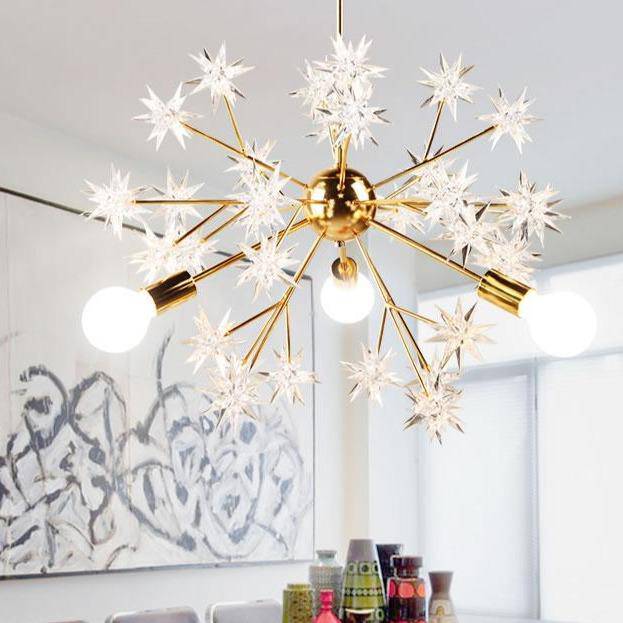Gilded design chandelier with Loft stars