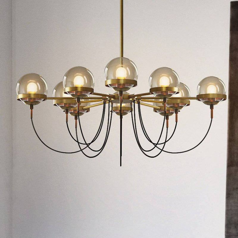 Lustre design industriel doré avec boule en verre