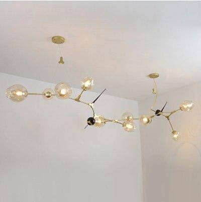 Lámpara de araña design moderno LED dorado y negro con bolas de cristal y pinchos