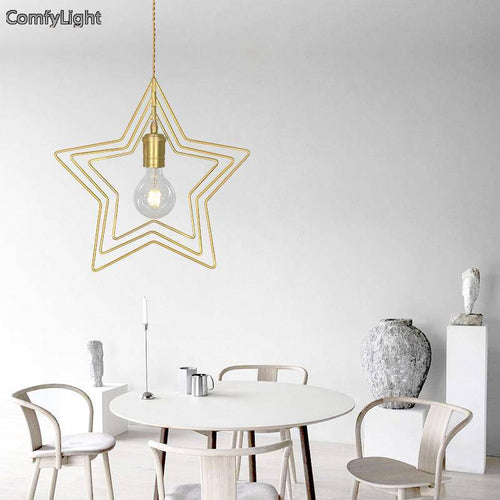 Pendant light in the shape of a golden star Dining