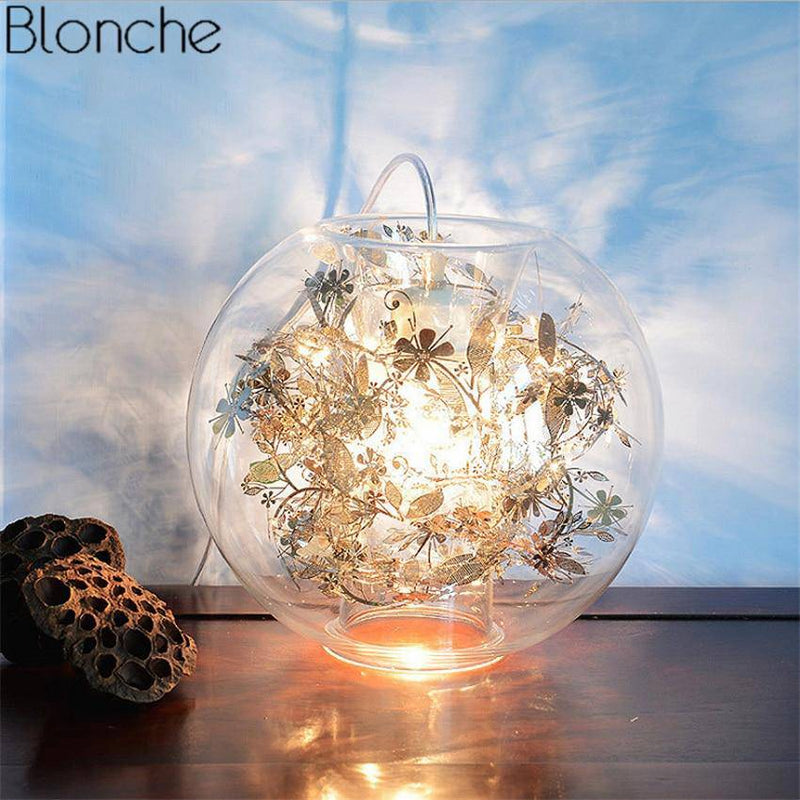 Lampe à poser boule en verre avec feuilles