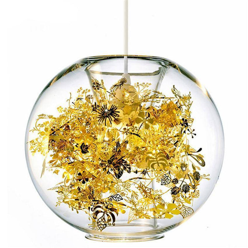 Lámpara de mesa con bola de cristal y hojas