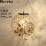 Lampe à poser boule en verre avec feuilles
