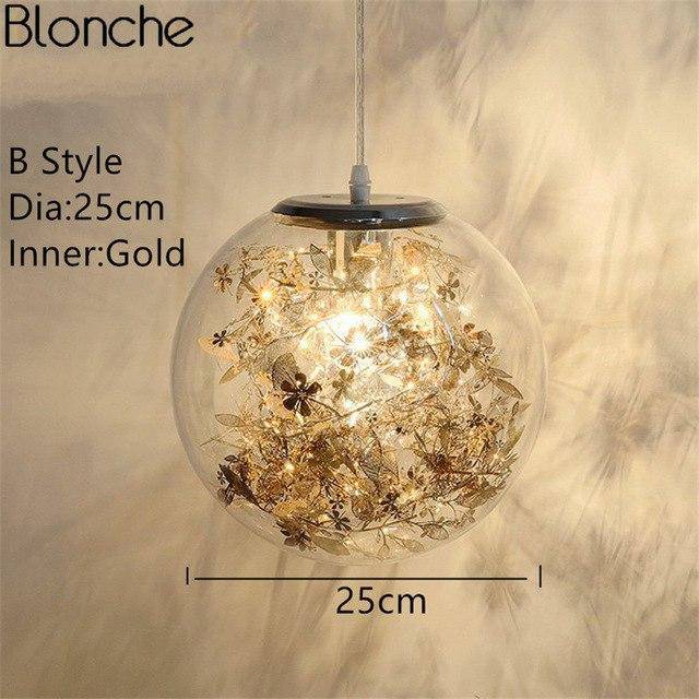 Lampe à poser boule en verre avec feuilles