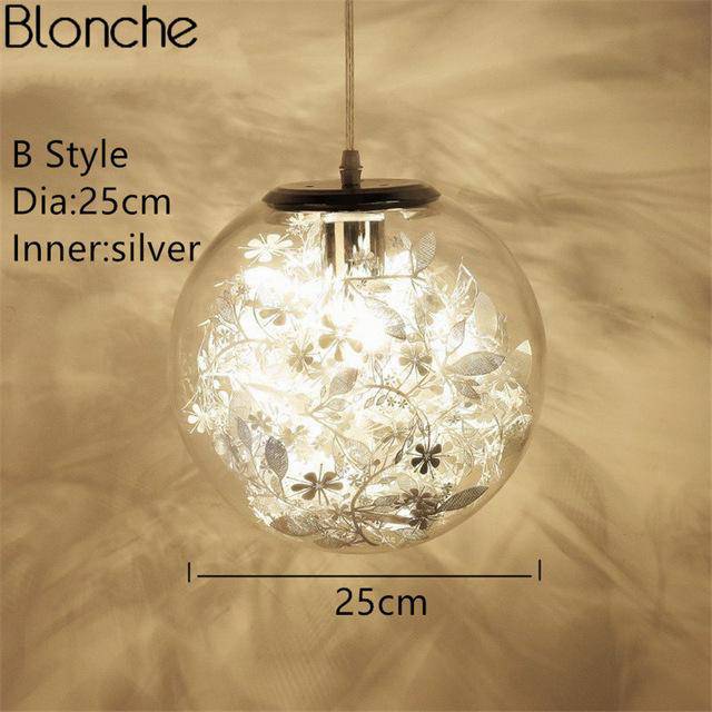 Lampe à poser boule en verre avec feuilles