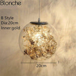 Lampe à poser boule en verre avec feuilles
