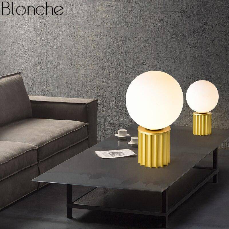 Design table lamp in gold metal with white LED ball