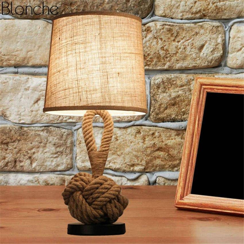 Bedside lamp with lampshade fabric and rope support