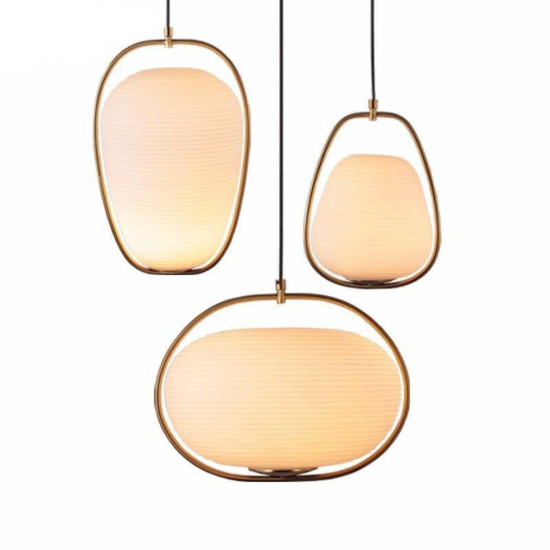 Suspension design LED dorée arrondie en verre style hang